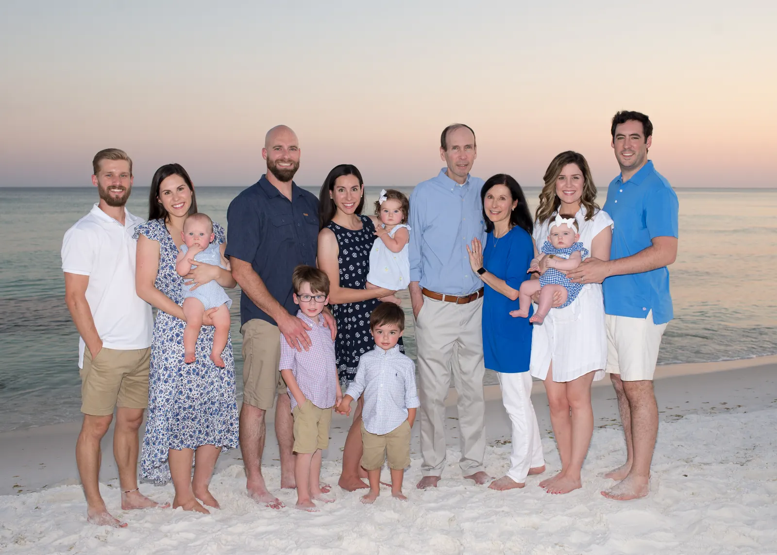 Large family group on the beach at sunset